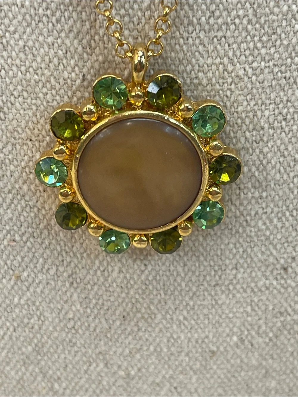 Gold-Tone Necklace with Beige Center and Green Crystal Halo